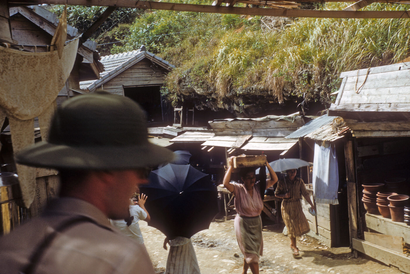 #32 Mamasan with package on head, 1953