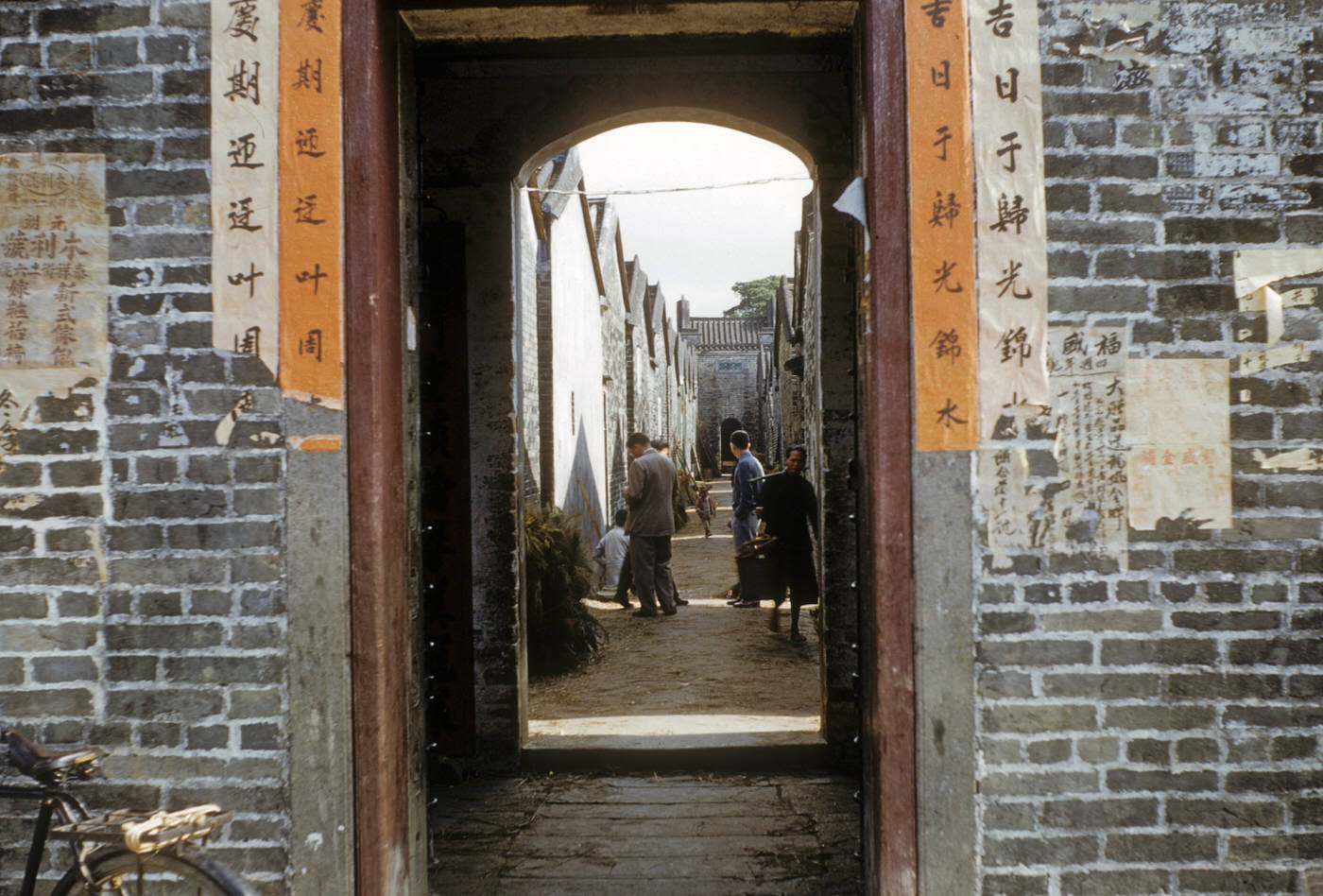 #66 Walled city through gate, 1954