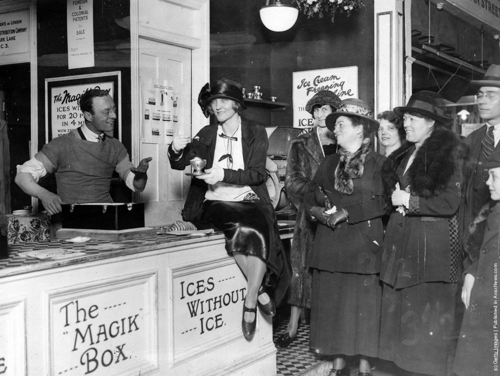 #20 Leslie Henson serving ice cream to Dorothy Dickson at the Daily Express Women’s Exhibition, London, 1923.