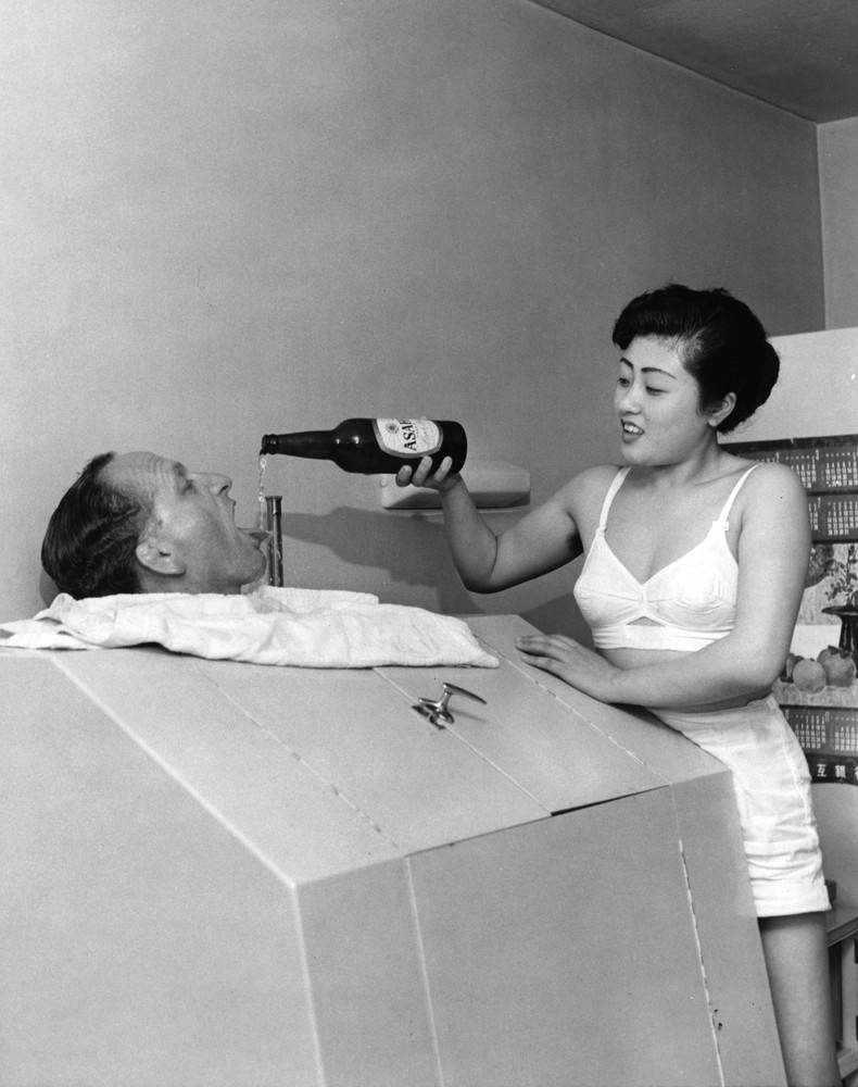 #10 A Geisha girl pouring a drink, 1950s.