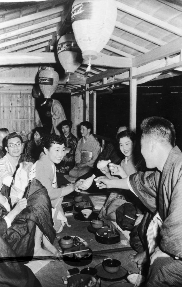#6 Geishas serving tea on a boat on the Nagara River, 1950s.