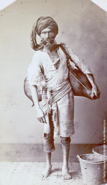#8 A water carrier in India, 1870.