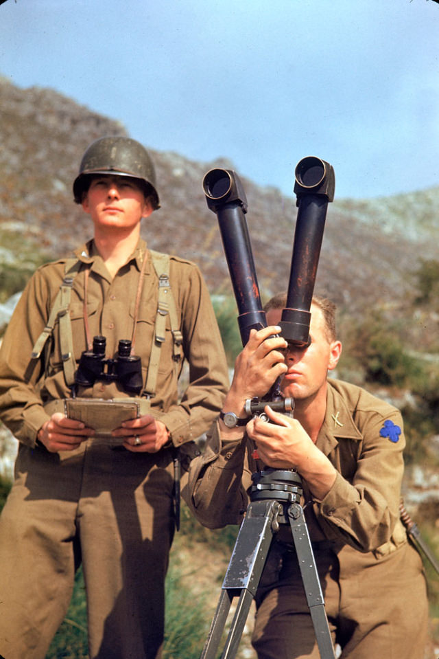 #12 An American soldier scouting German positions during the Allied drive towards Rome, 1944.