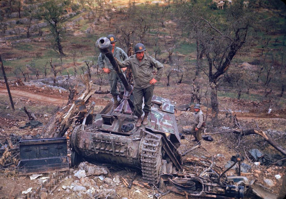 #20 American troops surveying destroyed German armor during the drive towards Rome, 1944.