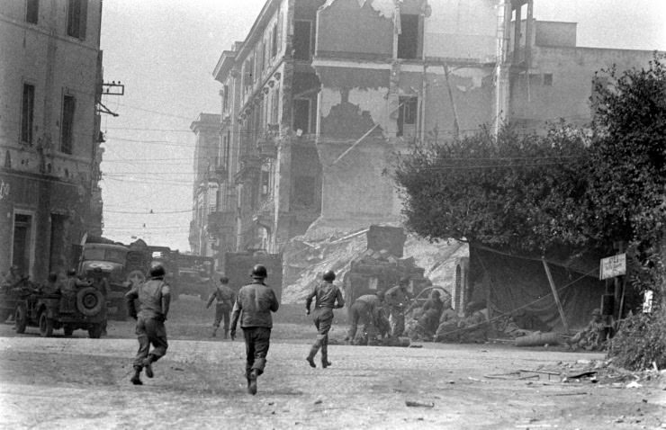 #30 Troops attending to a wounded comrade at Anzio, 1944.