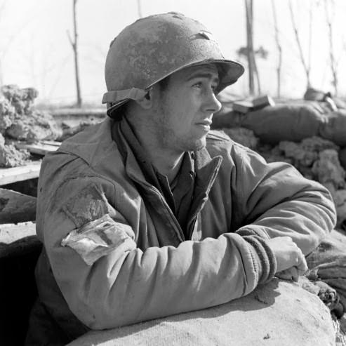 #35 Medic Pvt. E. Armitage sunbathing at Anzio, 1944.