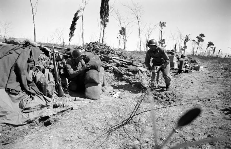 #37 Soldiers ducking German fire at Anzio, 1944.