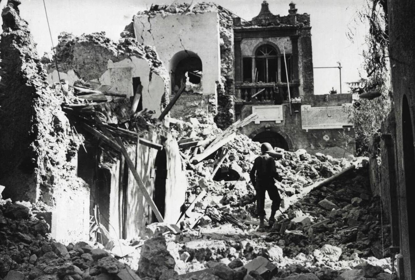 #48 The wrecked Fascist headquarters in Randazzo, Sicily, 1943.