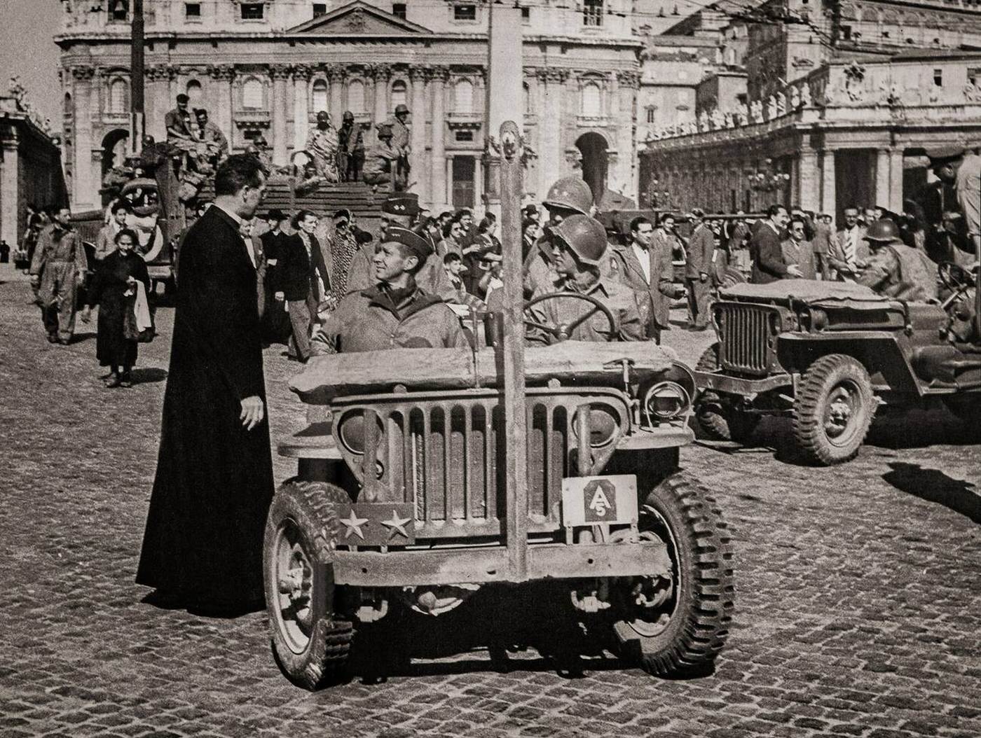 #51 General Mark Clark with a priest in front of St. Peter’s Cathedral, 1944.