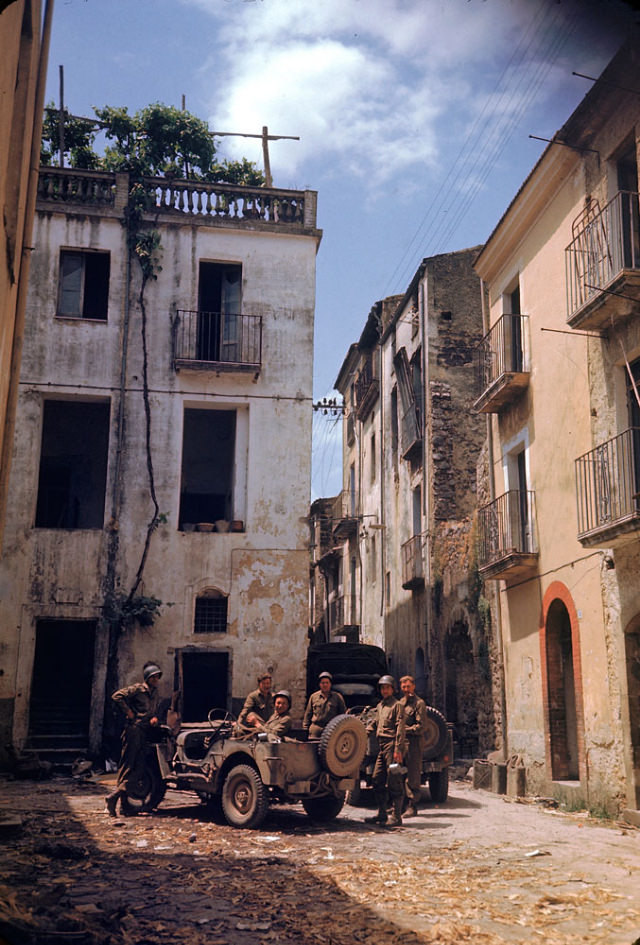 #6 American soldiers rested in a courtyard during the drive towards Rome, World War II, 1940s.
