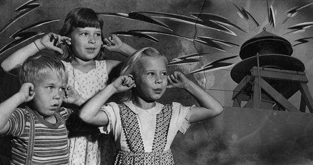 #10 The Hubik children—Julius, 6; Suerita, 10, and Margie, 7— voiced their reaction today to the wailing of Los Angeles’ air raid sirens and ringing of church bells at noon as Fourth of July was celebrated. The blast also served as a country-wide test for the air raid sirens. July 4, 1951.