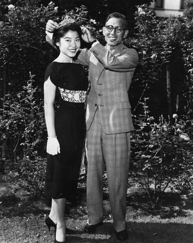 #12 Ayleen Ito, 18, is crowned as queen of 27th annual American Legion Fourth of July fireworks show at Coliseum by Yukio Hasumi, consul-general of Japan in Los Angeles. June 24, 1959.