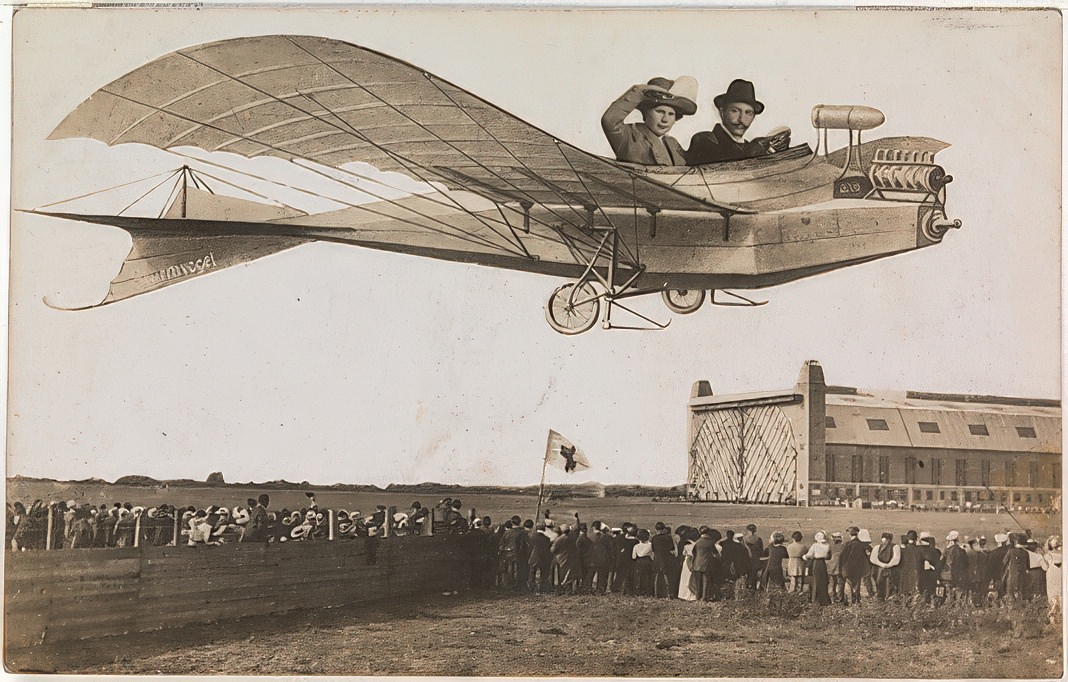 Couple Flying Airplane Over Crowd, 1910s
