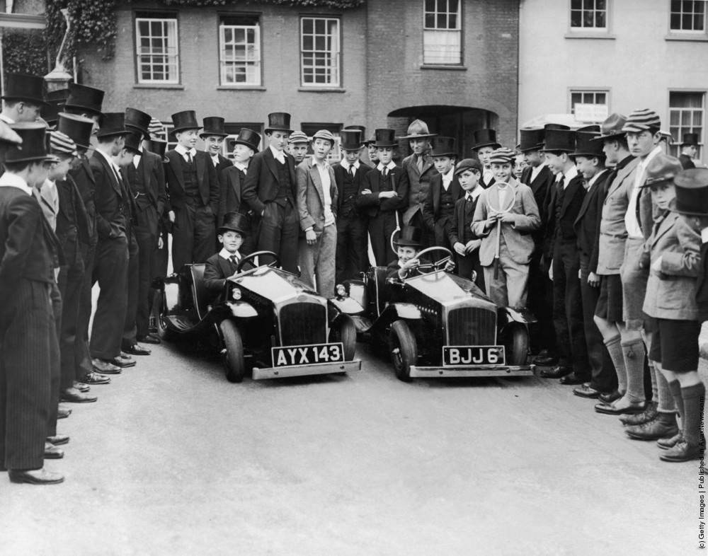 Pupils at Eton College watch two of their peers driving midget Rytecraft Scootercars. 1934.