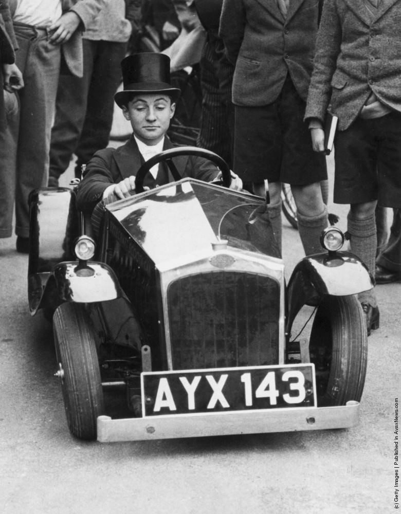 A young Etonian test drives the world’s smallest car during a demonstration at Eton College. 31st October 1934.