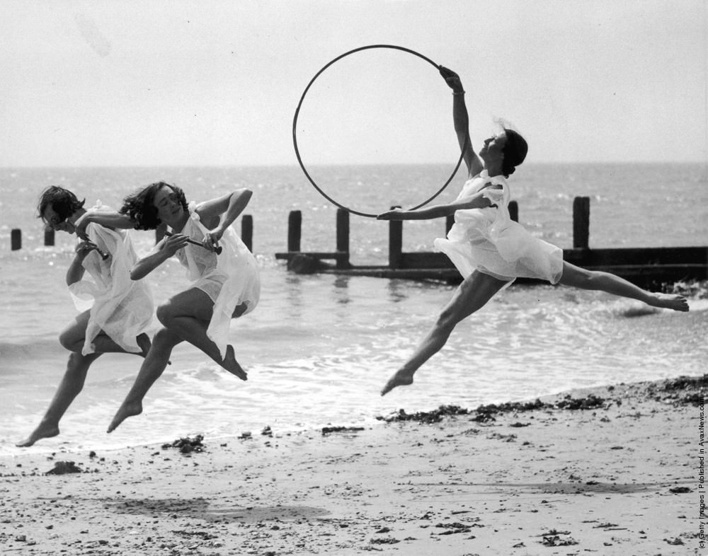#5 Dancers rehearsing on the beach at Worthing, one with a hoop, two with pipes, 1935.