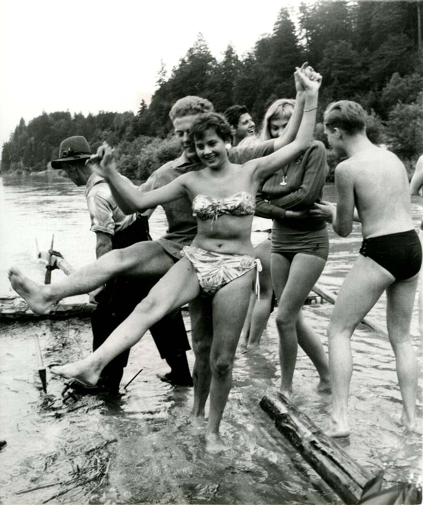 #15 Members of the Hot Club Munich Jazz-Disco on a raft trip on the Isar River, 1960s.
