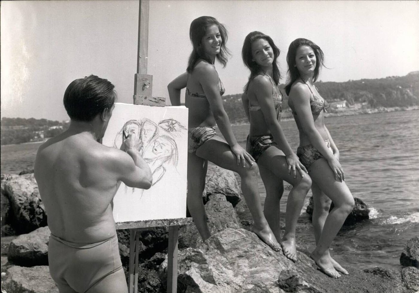 #16 The Bisconti triplets posing for painter Arrieu on the beach, 1961.