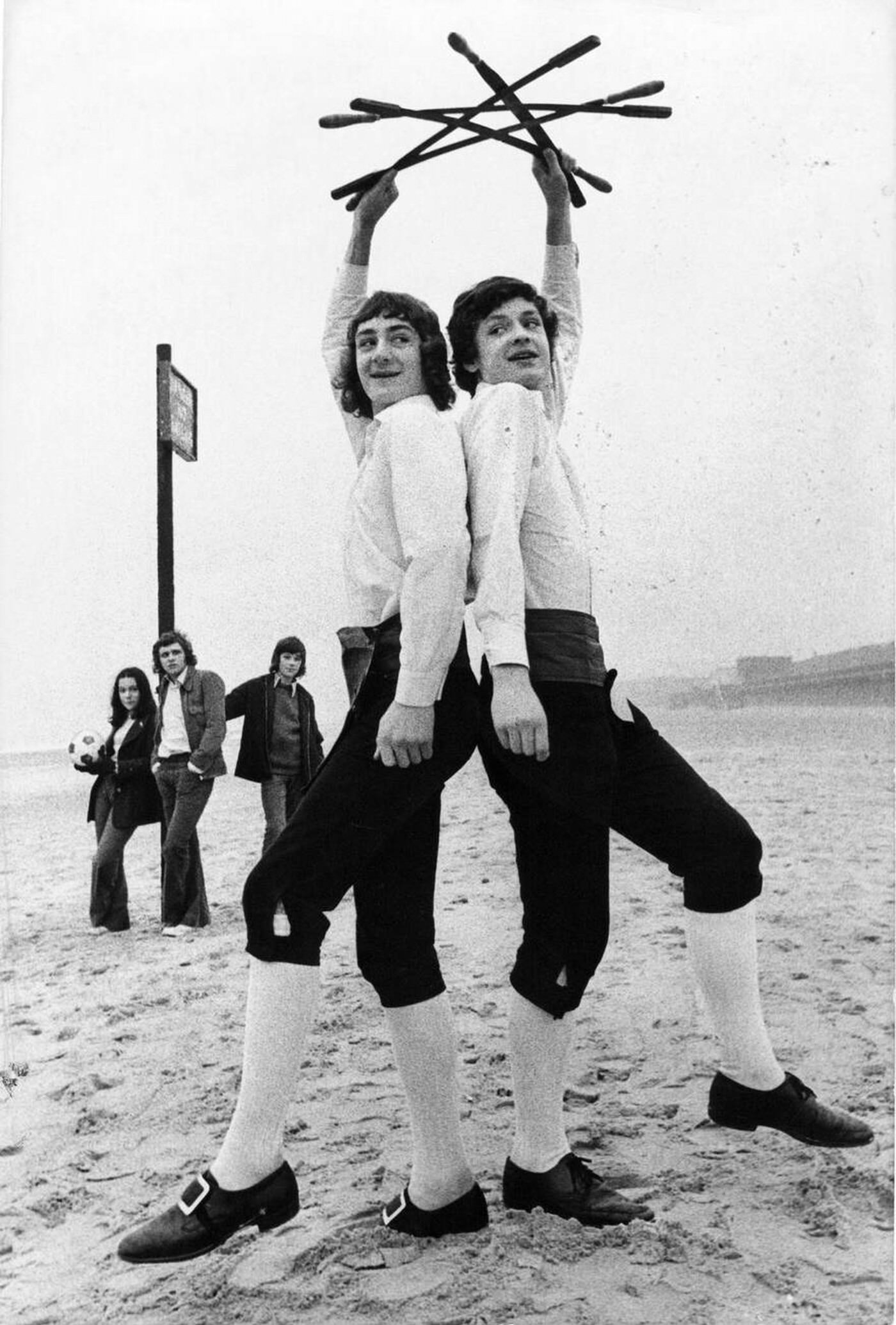 #18 Morris dancing brothers Timothy and Nicholas Bristow practicing on the beach at Whitley Bay.
