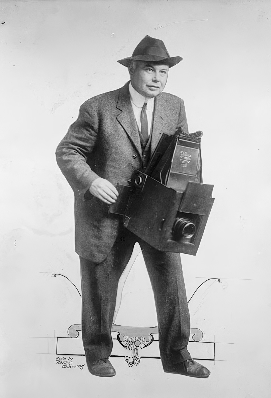 Photographer with a portable large format camera, 1914.
