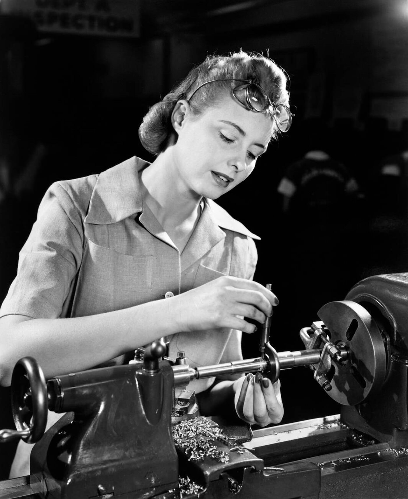 #104 A woman working on a lathe, 1940s