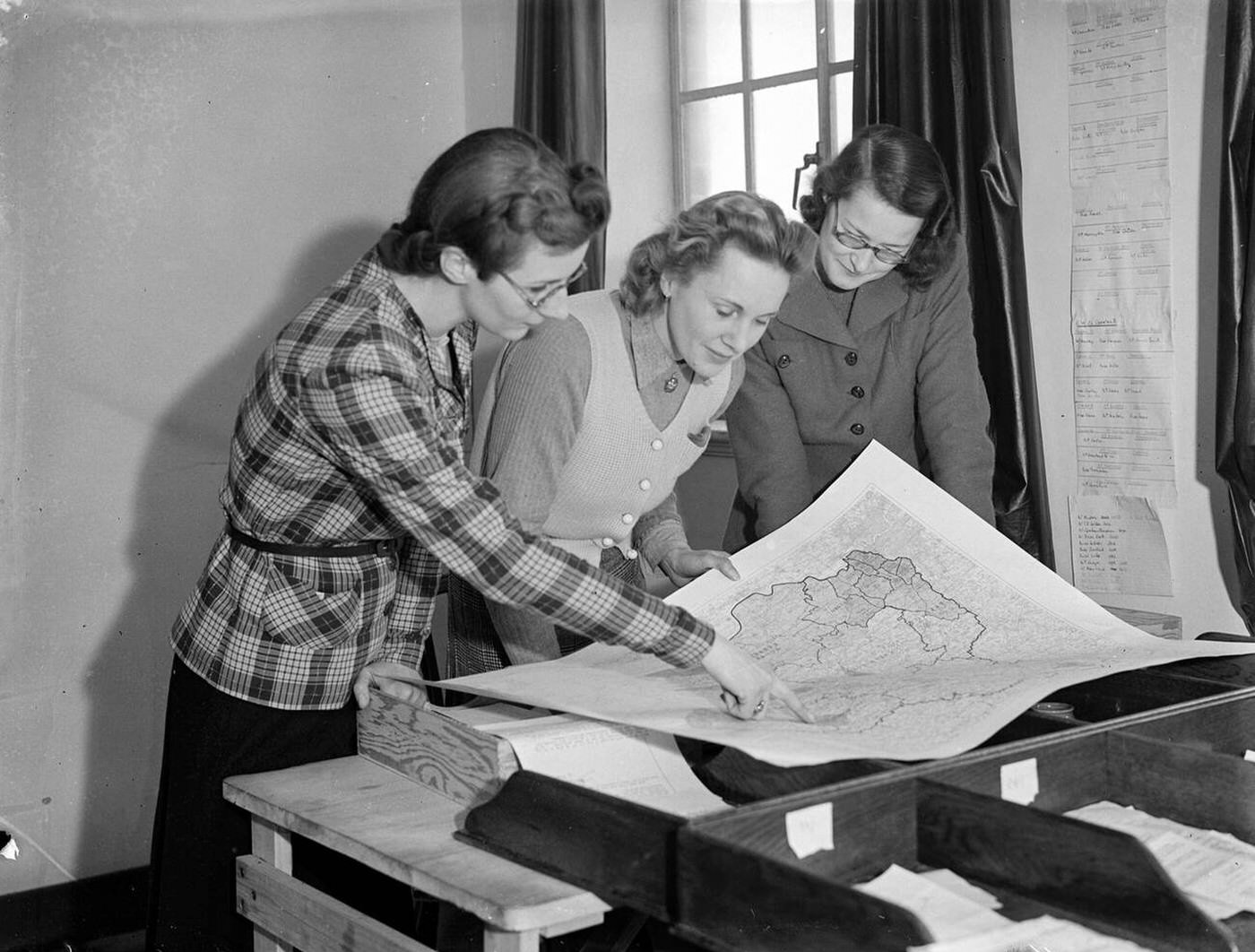 #112 Women supervising scrap metal collection, 1942