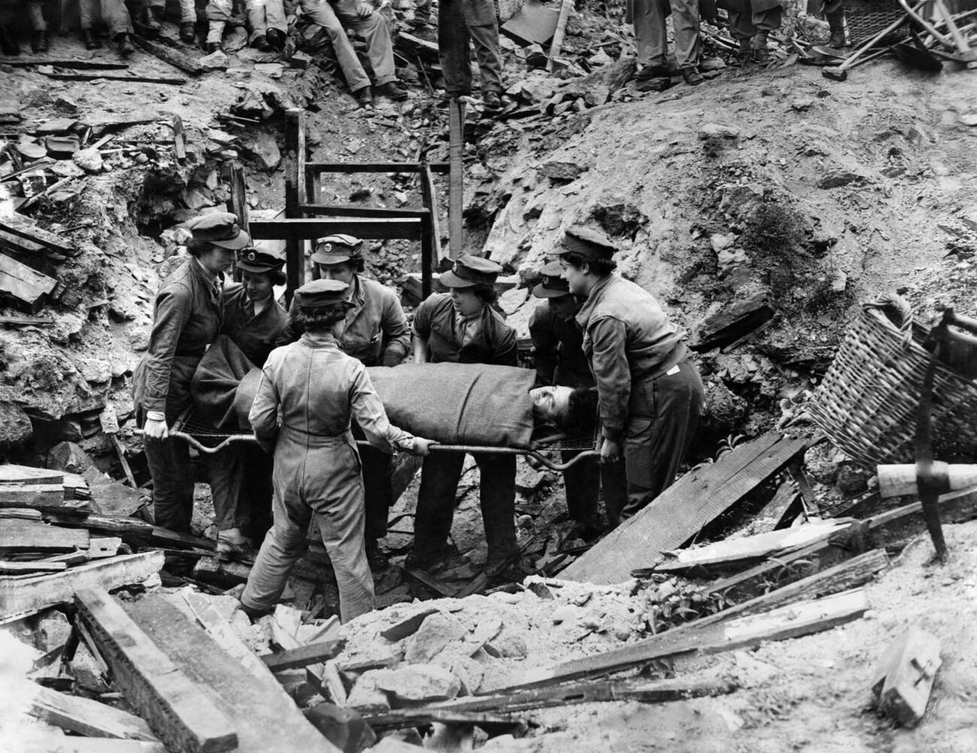 #114 ATS members removing casualties, 1944