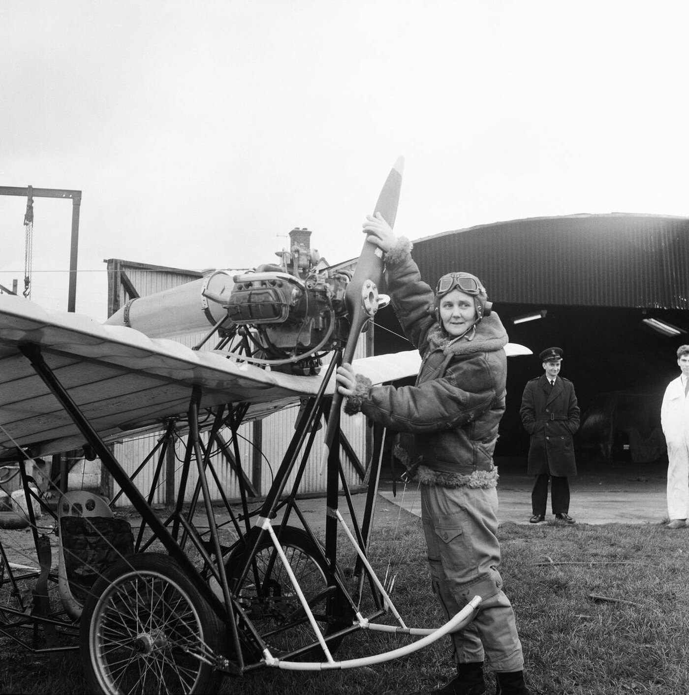 #128 Joan Hughes testing a plane for a film, 1964