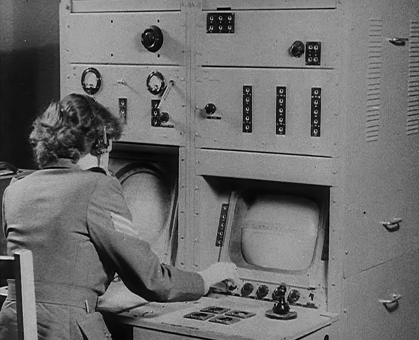 #155 A woman operating a radio, 1940