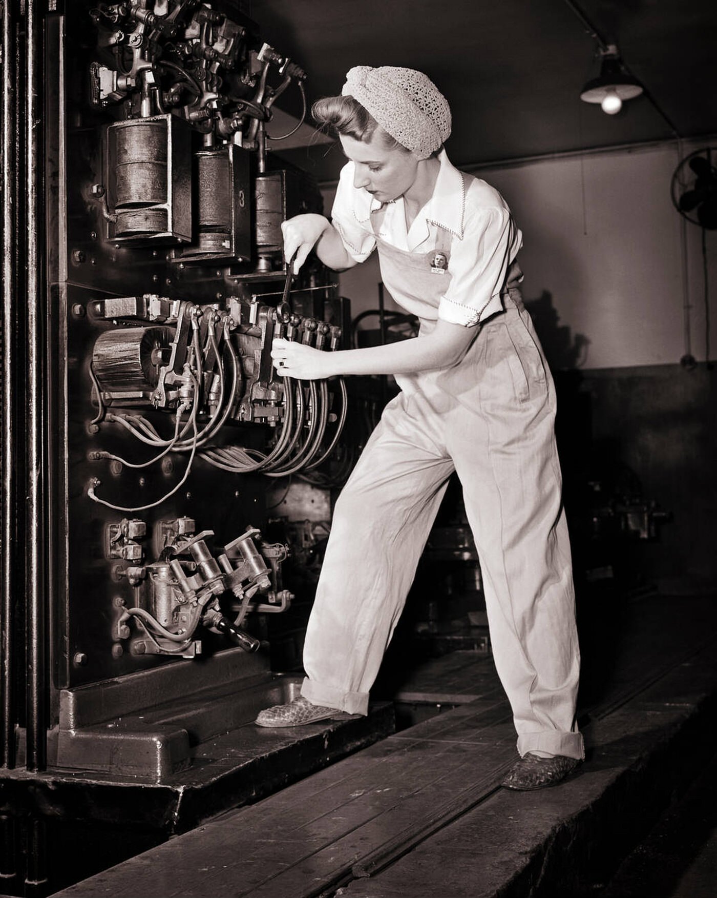 #166 A woman working as an elevator mechanic, 1940s