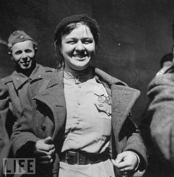 #34 A female Russian soldier showing off medals, 1945