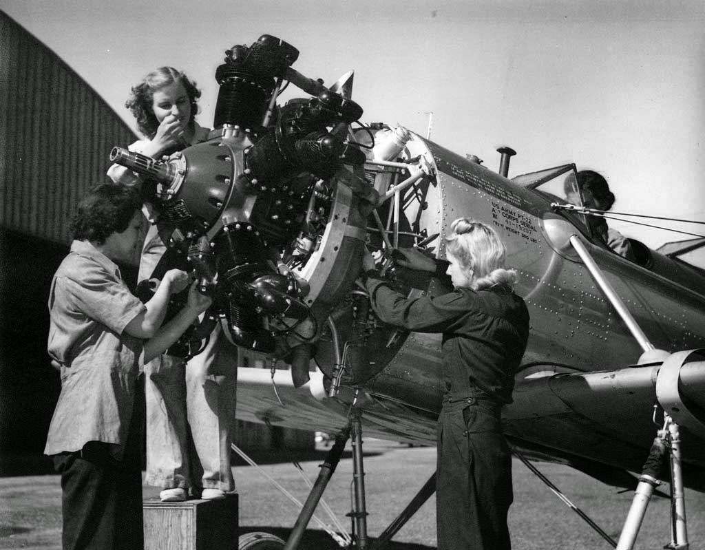 #43 Women mechanics working on an airplane, World War II