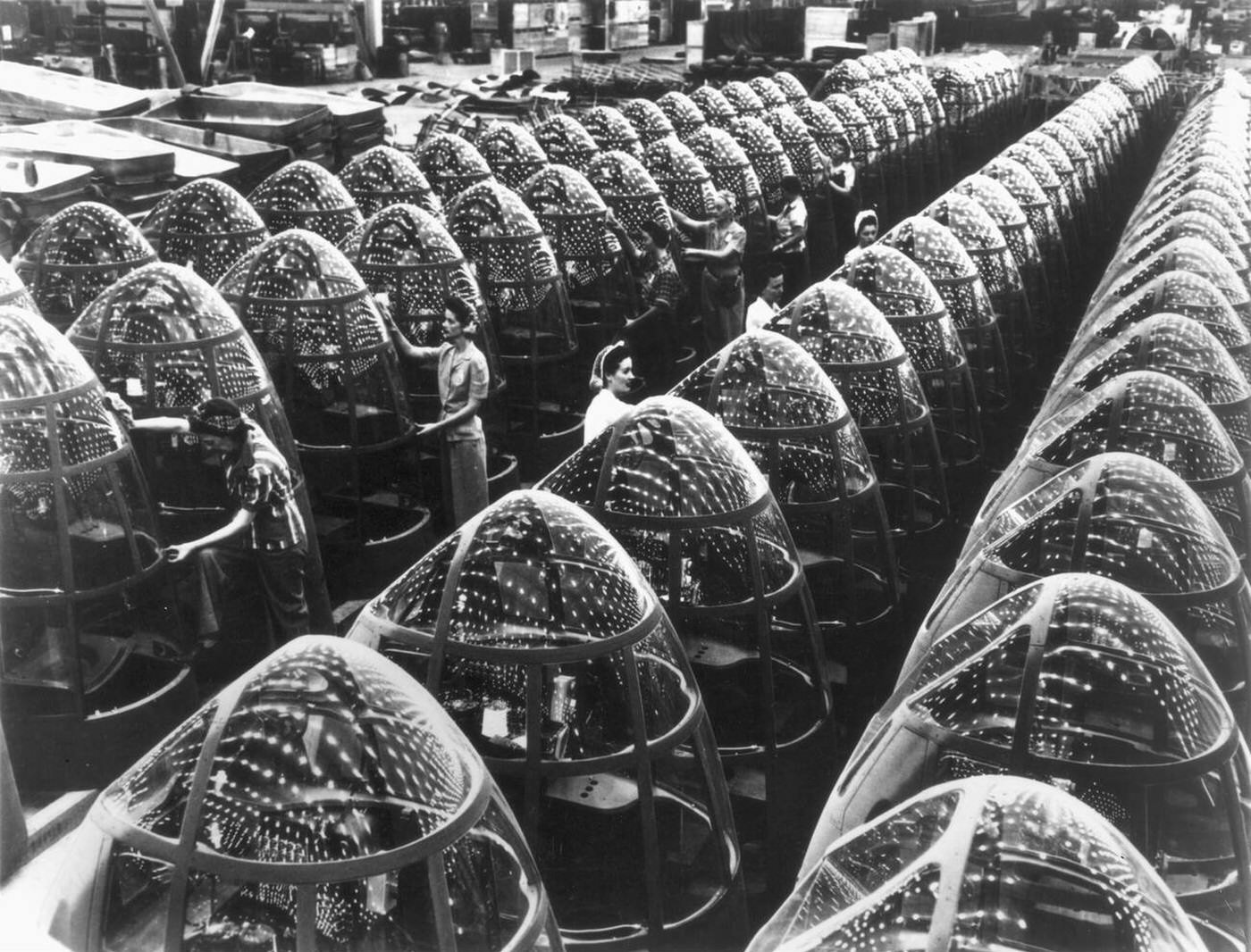 #83 Women making plastic noses for bombers, 1942