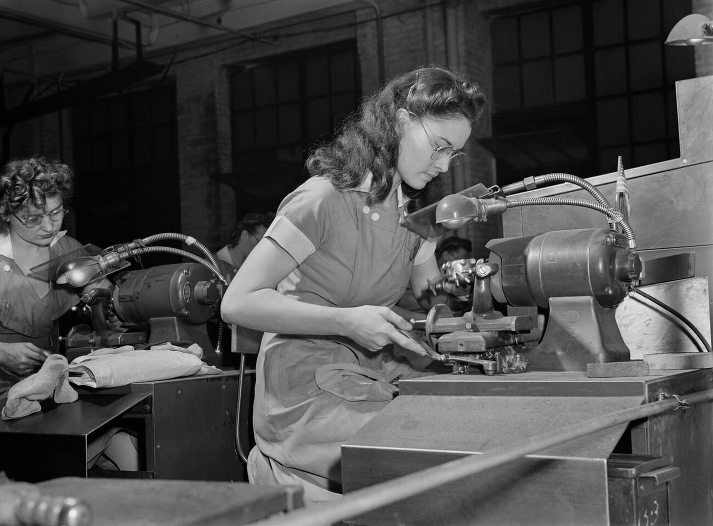 #96 Female factory workers operating machinery, 1942