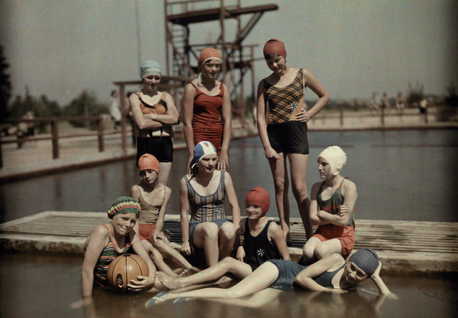 #14 Teenage girls in bathing suits and caps on a dock in Germany, March 1928.