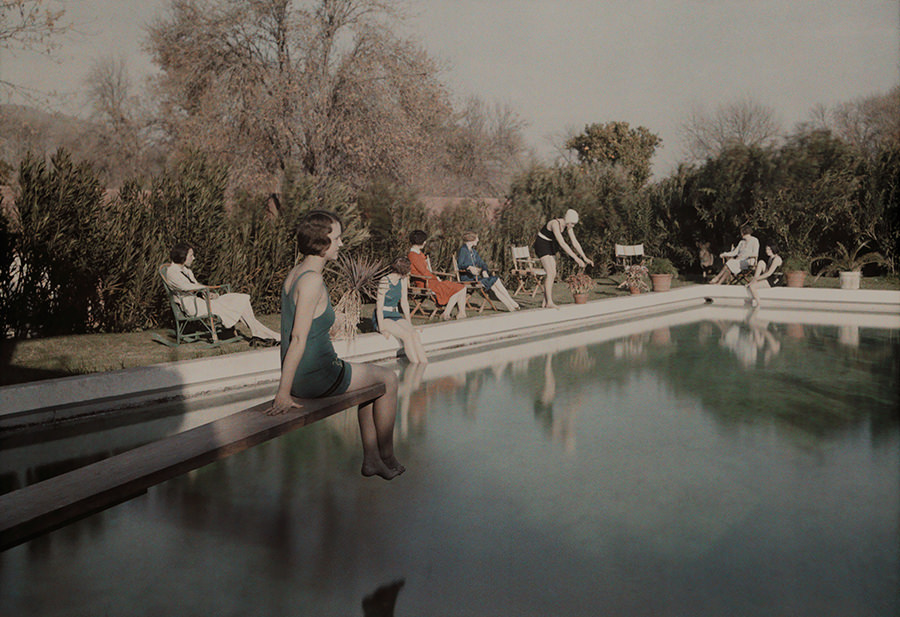 #18 Women relax beside a swimming pool at a country estate near Phoenix, Arizona, 1928.