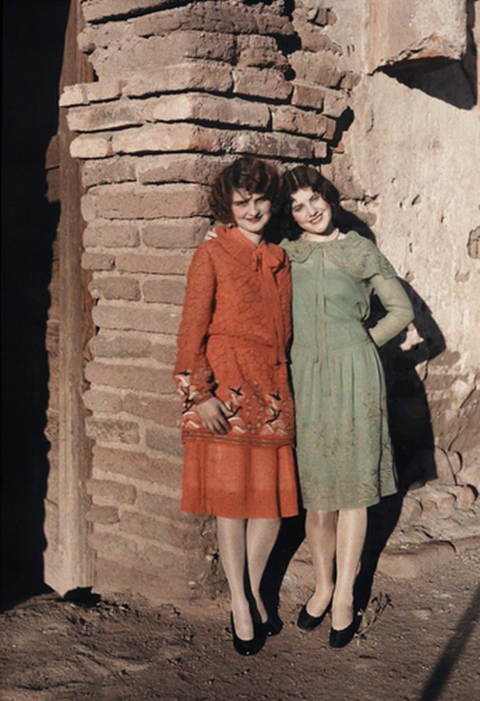 #4 Two Mexican girls pose against a brick wall in Nogales, ca. 1920s.
