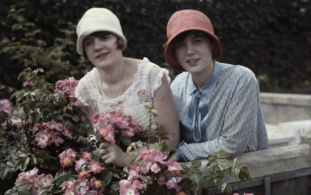 #8 Two young women pose together in a rose garden in Cologne, 1929.
