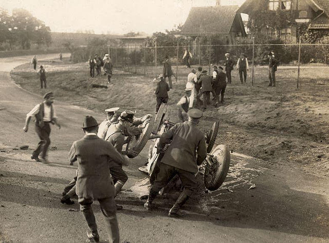 Car racing accident on the Grunewald racing track in Berlin, injured driver is carried away, 1921.