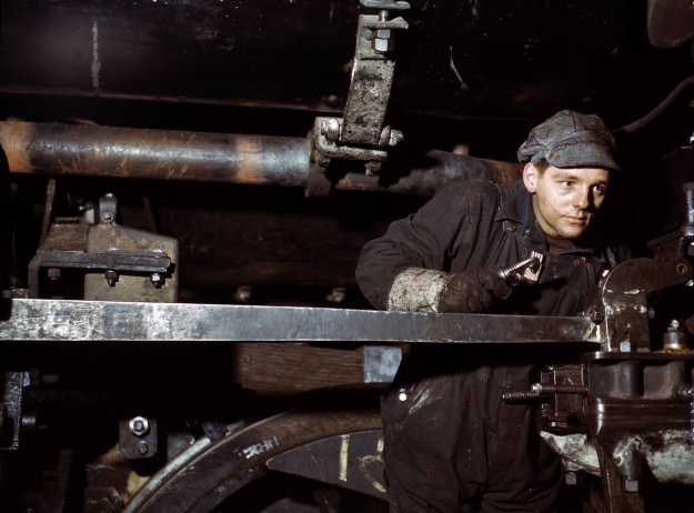 December 1942. A young worker at the Chicago &; North Western 40th Street shops. 4×5 Kodachrome transparency by Jack Delano.