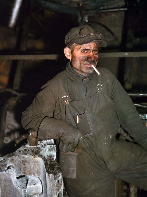 December 1942. Melrose Park, Illinois. “Chicago &; North Western RR. William London has been a railroad worker 25 years — now working at the roundhouse at the Proviso yards.” 4×5 Kodachrome transparency by Jack Delano for the Office of War Information.