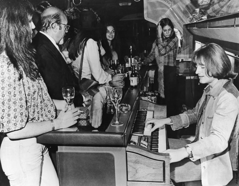 John Paul Jones of Led Zeppelin playing an organ on board their Boeing 720B “The Starship”, 1973.