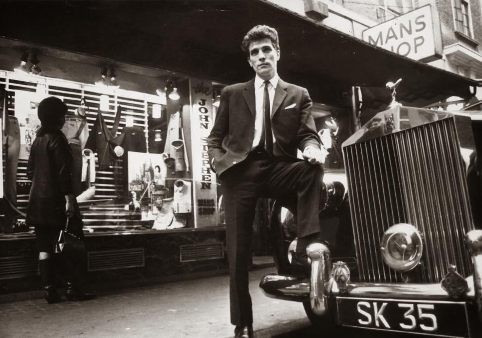 #12 February 1964: Tailor John Stephen, with his Rolls Royce outside his shop.