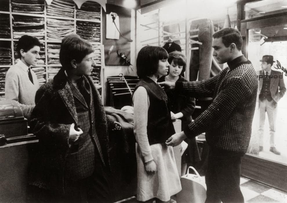 #10 May 1964: A ‘Mod’ girl gets measured for a suit.