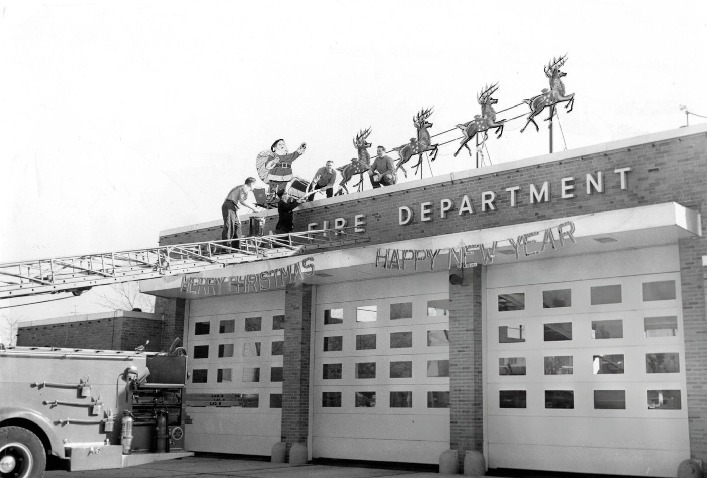 #19 Firemen decorate their station with Santa Claus and his reindeer in the Dorchester neighborhood of Boston, 1959.