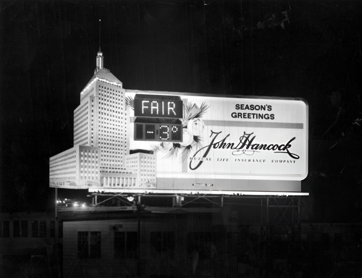 #26 A billboard for John Hancock Mutual Life Insurance Company displays the weather and time in Boston, 1962.