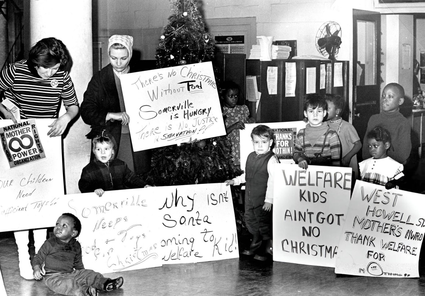 #37 Mothers and children protest for toys, food and clothing for the Christmas holiday at the welfare office in Boston, 1968.