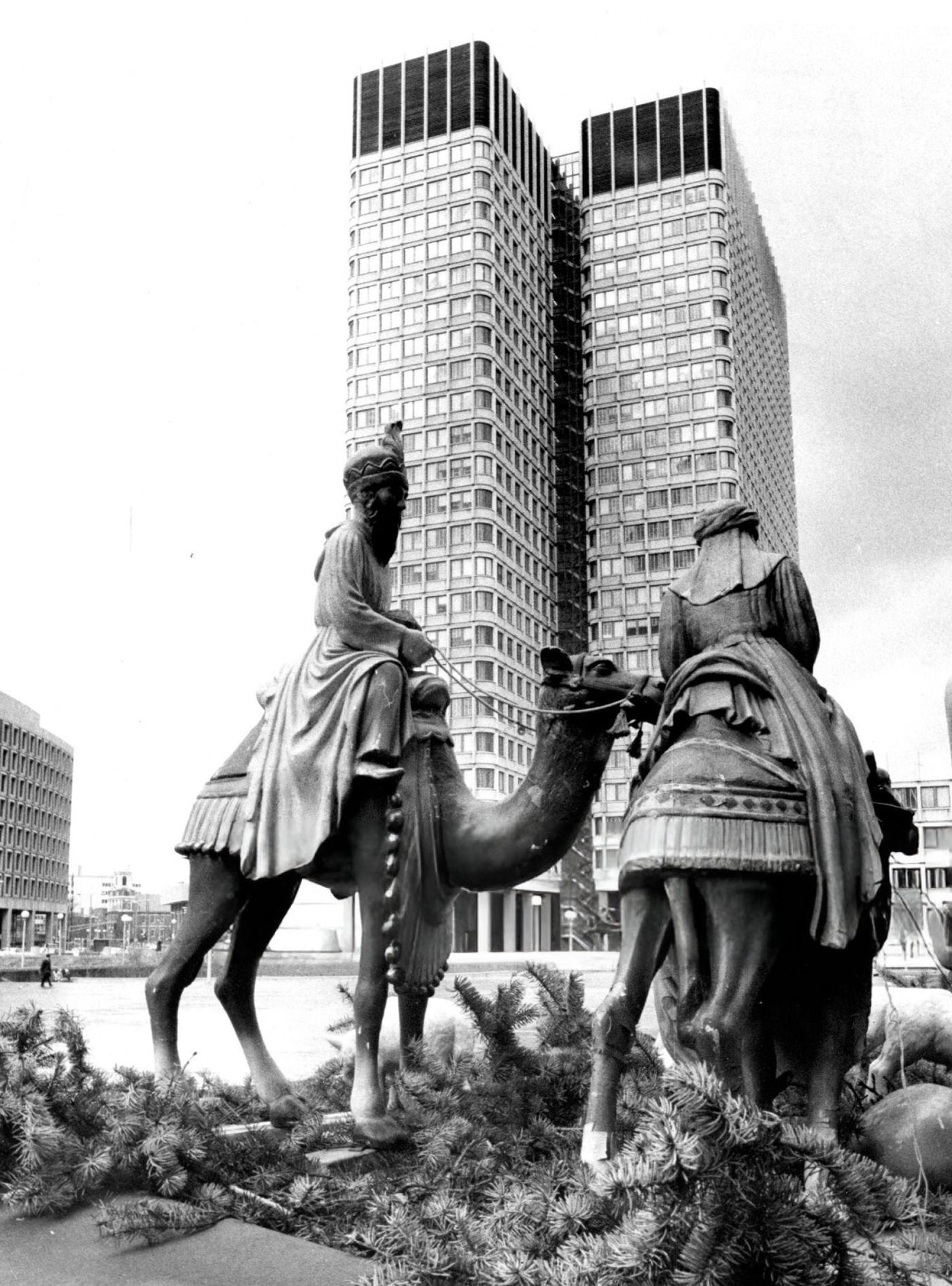 #42 The John F. Kennedy Federal Building looms over the Christmas nativity scene at City Hall Plaza in Boston, 1970.