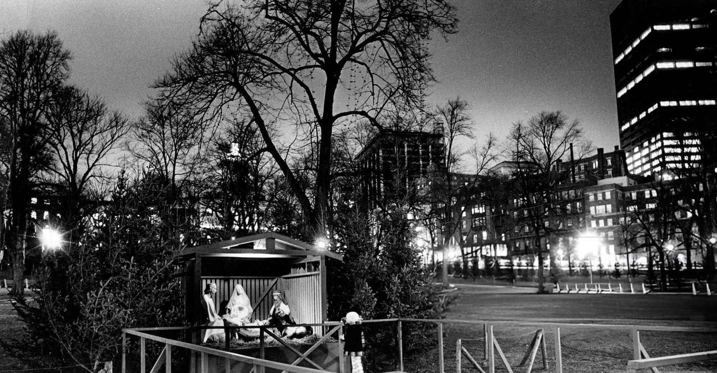 #46 A young girl looks at the nativity scene on Boston Common before the lighting of the Christmas lights, 1973.