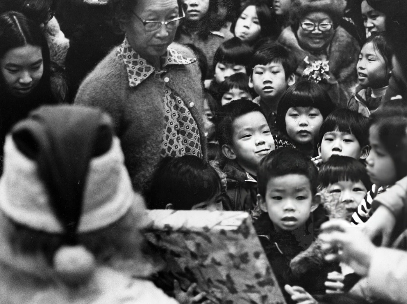 #51 Children from the Chinese community gather during a Christmas celebration at the Holy Trinity Church in Boston, 1975.